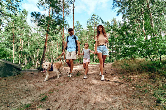 family hiking with their dog